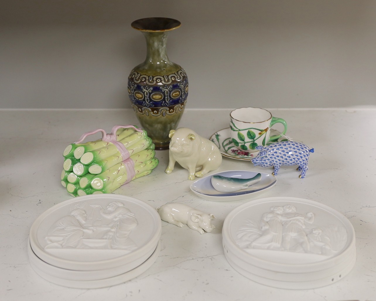 A Herend asparagus box and pig, a Belleek pig, six Bing & Grondahl plaques, a Worcester cup and saucer, a Royal Doulton vase and three other items